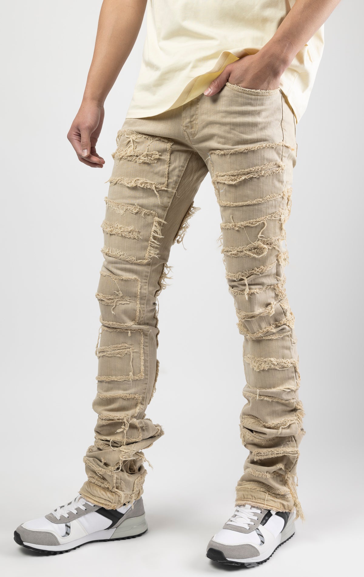 Cream bold, risk-taking flare pants feature a regular rise and extended length for maximum stacks. With a unique heavy wash and rip and repair design, complete with patches and abrasions, these skinny fit jeans are ready for adventure. Made from 98% cotto