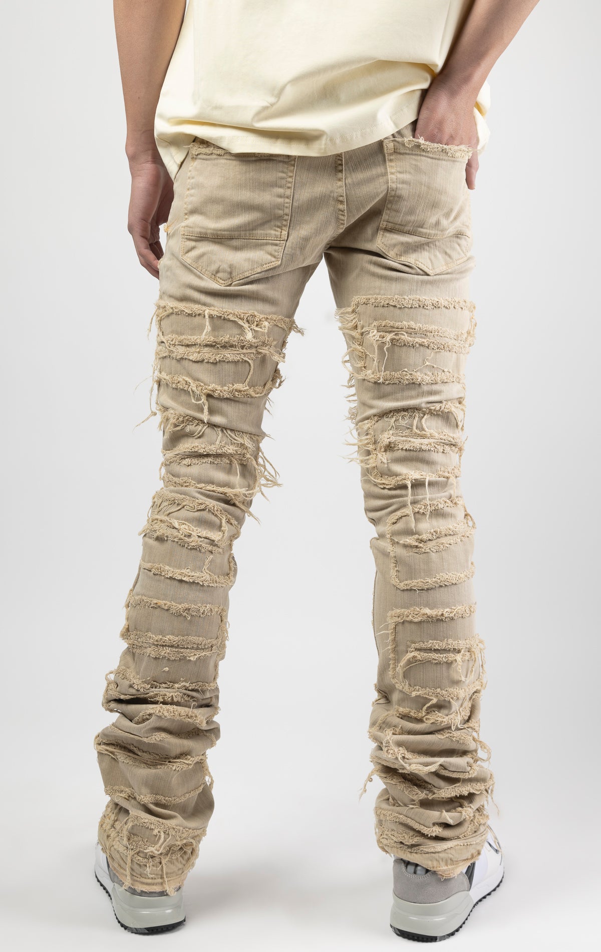 Cream bold, risk-taking flare pants feature a regular rise and extended length for maximum stacks. With a unique heavy wash and rip and repair design, complete with patches and abrasions, these skinny fit jeans are ready for adventure. Made from 98% cotto