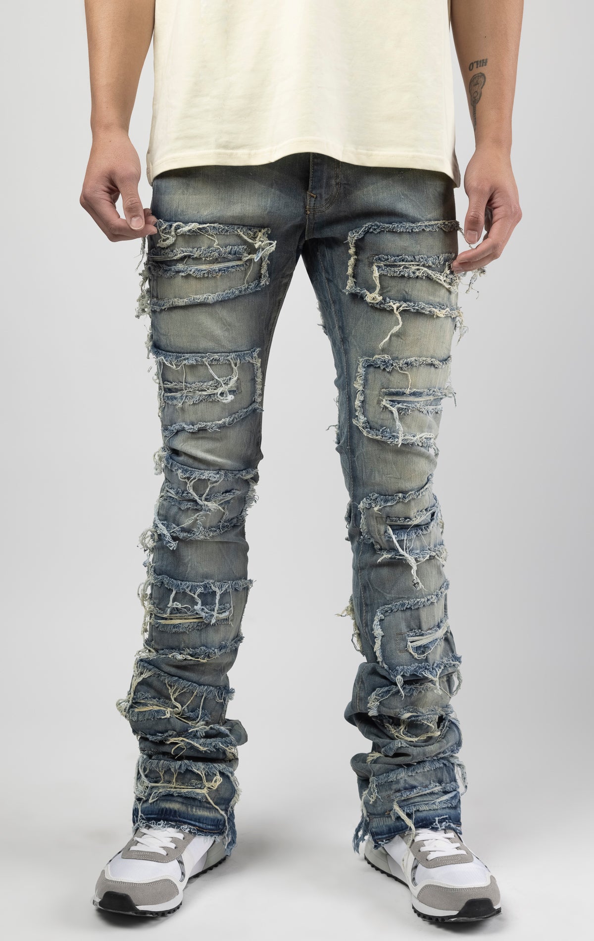 Lager bold, risk-taking flare pants feature a regular rise and extended length for maximum stacks. With a unique heavy wash and rip and repair design, complete with patches and abrasions, these skinny fit jeans are ready for adventure. Made from 98% cott