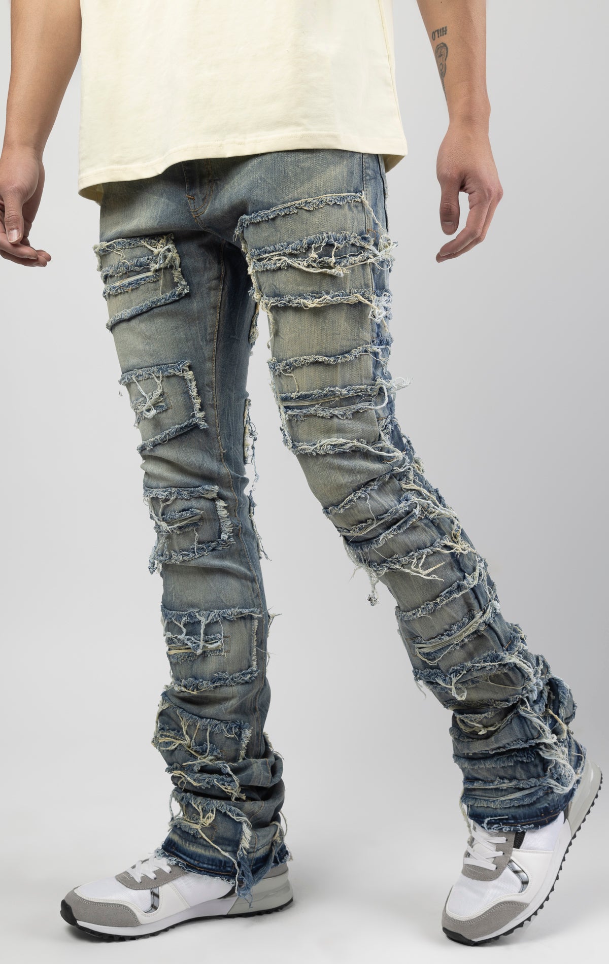 Lager bold, risk-taking flare pants feature a regular rise and extended length for maximum stacks. With a unique heavy wash and rip and repair design, complete with patches and abrasions, these skinny fit jeans are ready for adventure. Made from 98% cotto