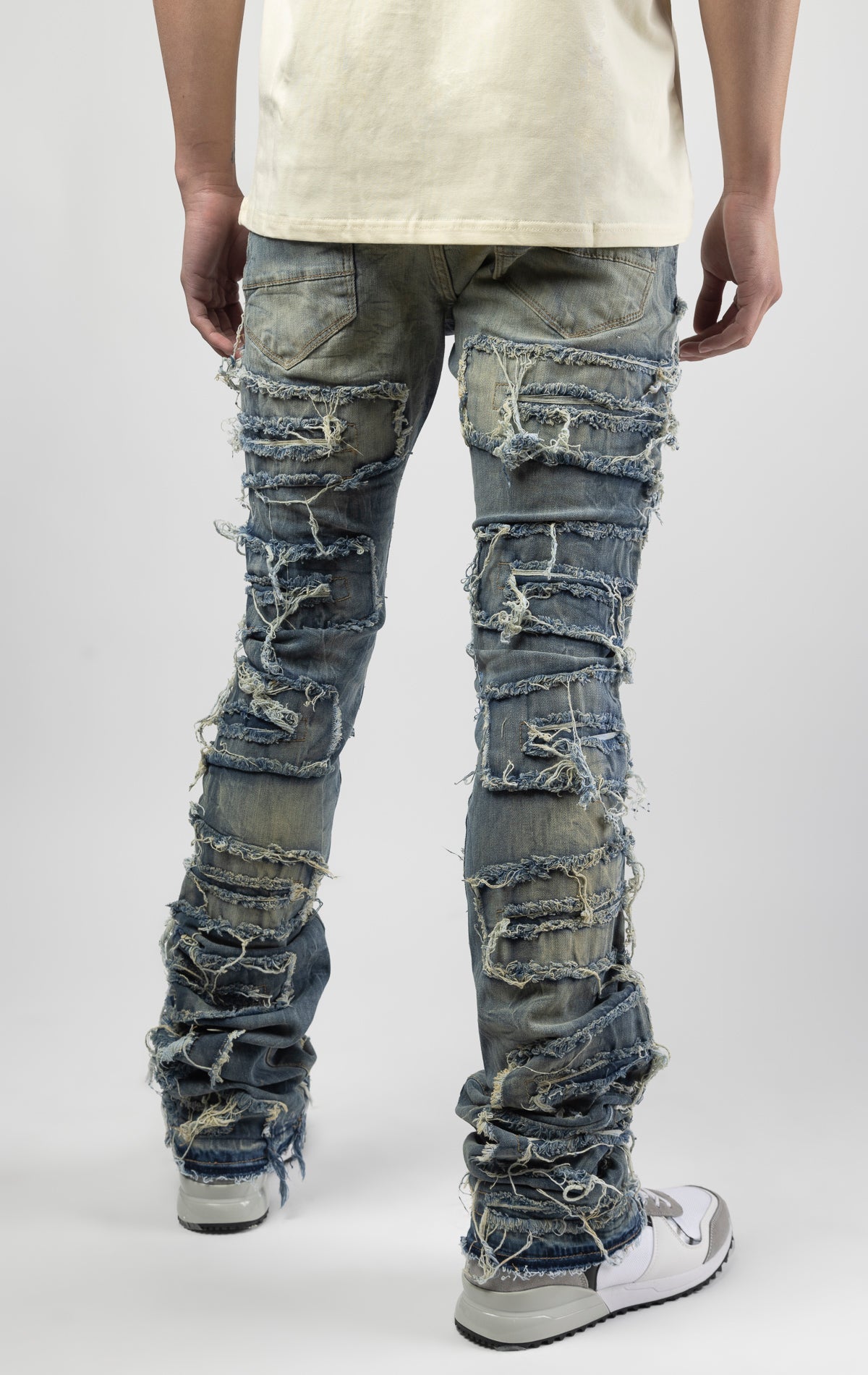Lager bold, risk-taking flare pants feature a regular rise and extended length for maximum stacks. With a unique heavy wash and rip and repair design, complete with patches and abrasions, these skinny fit jeans are ready for adventure. Made from 98% cotto