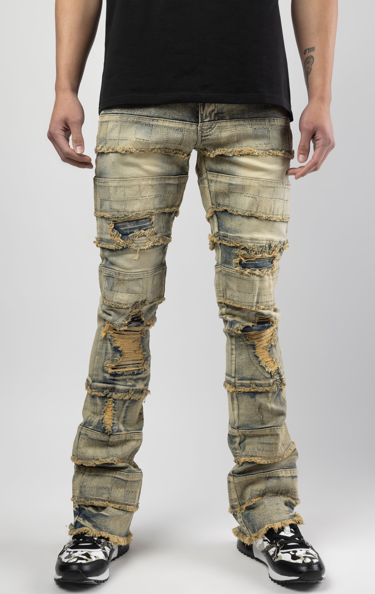 Dirt wash iconic stacked jeans crafted from high-quality, durable denim fabric consisting of 98% cotton and 2% spandex with a semi flare silhouette and a length of 35"-37". Featuring a distinctive ripped and repair design with pocket patches and a multi-t