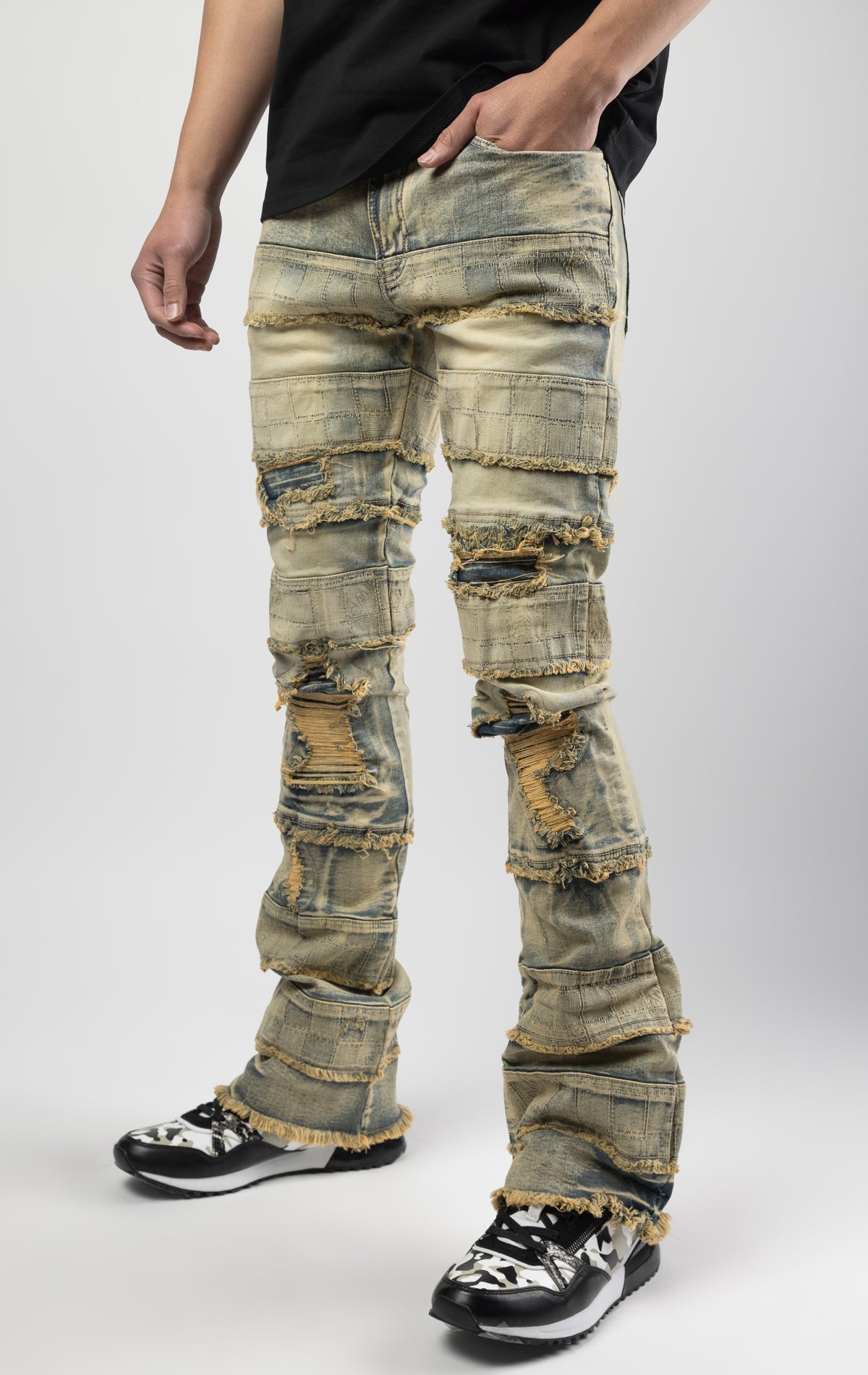 Dirt wash iconic stacked jeans crafted from high-quality, durable denim fabric consisting of 98% cotton and 2% spandex with a semi flare silhouette and a length of 35"-37". Featuring a distinctive ripped and repair design with pocket patches and a multi-t
