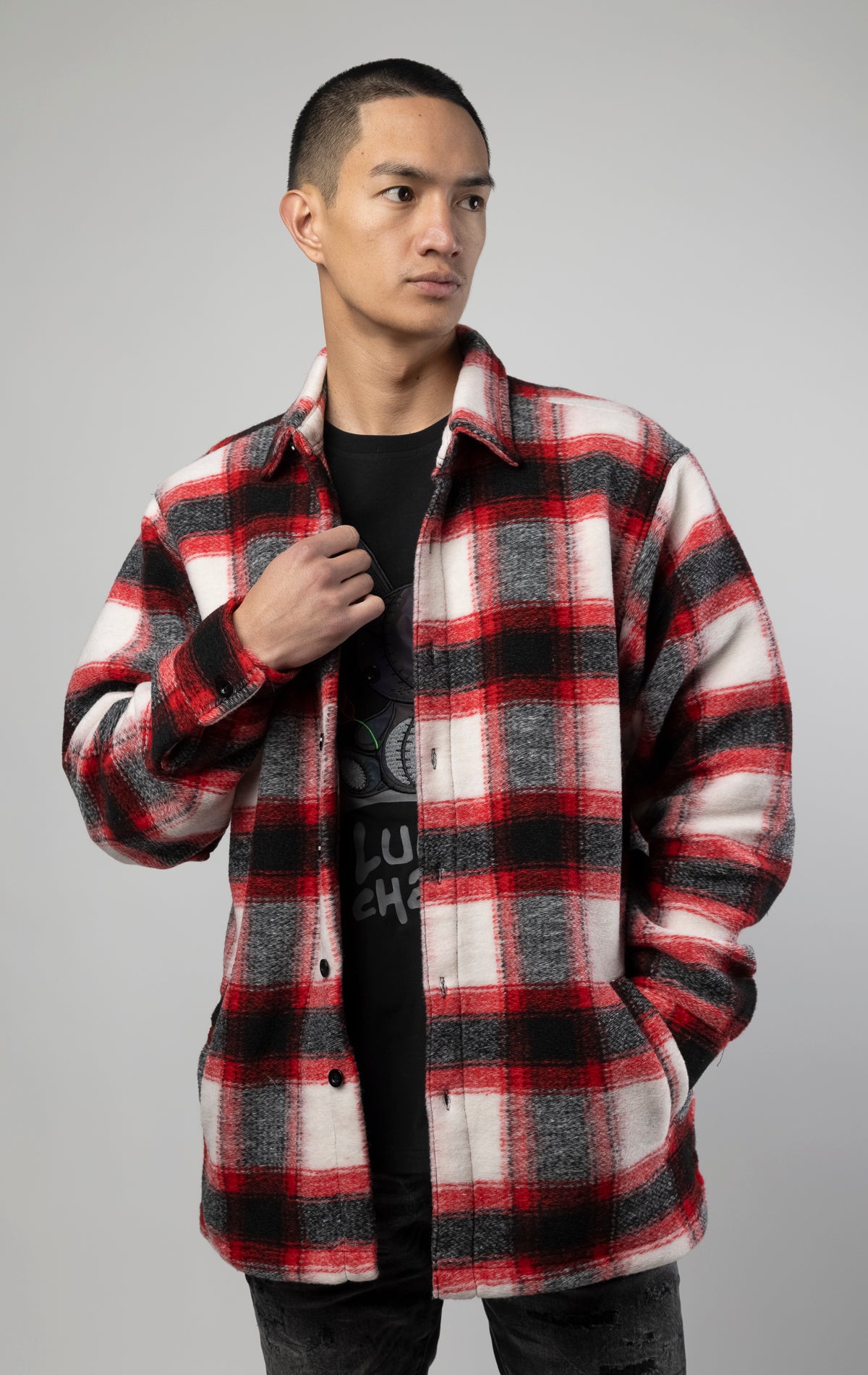 Model wearing Red, white and black oversized button up shirt made from soft, felted fabric
