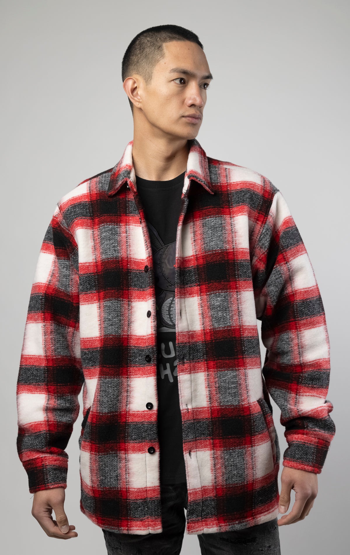 Model wearing Red, white and black oversized button up shirt made from soft, felted fabric