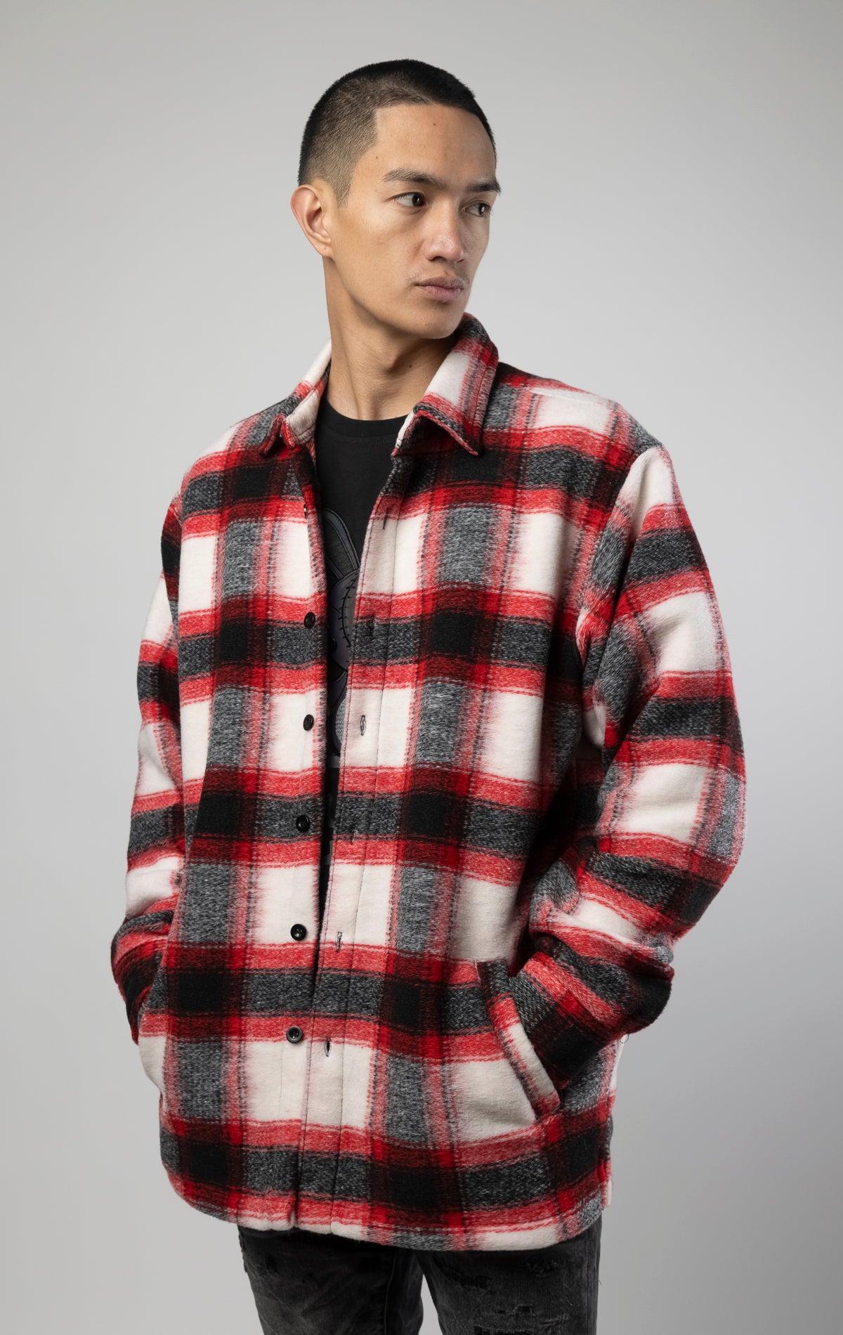 Model wearing Red, white and black oversized button up shirt made from soft, felted fabric