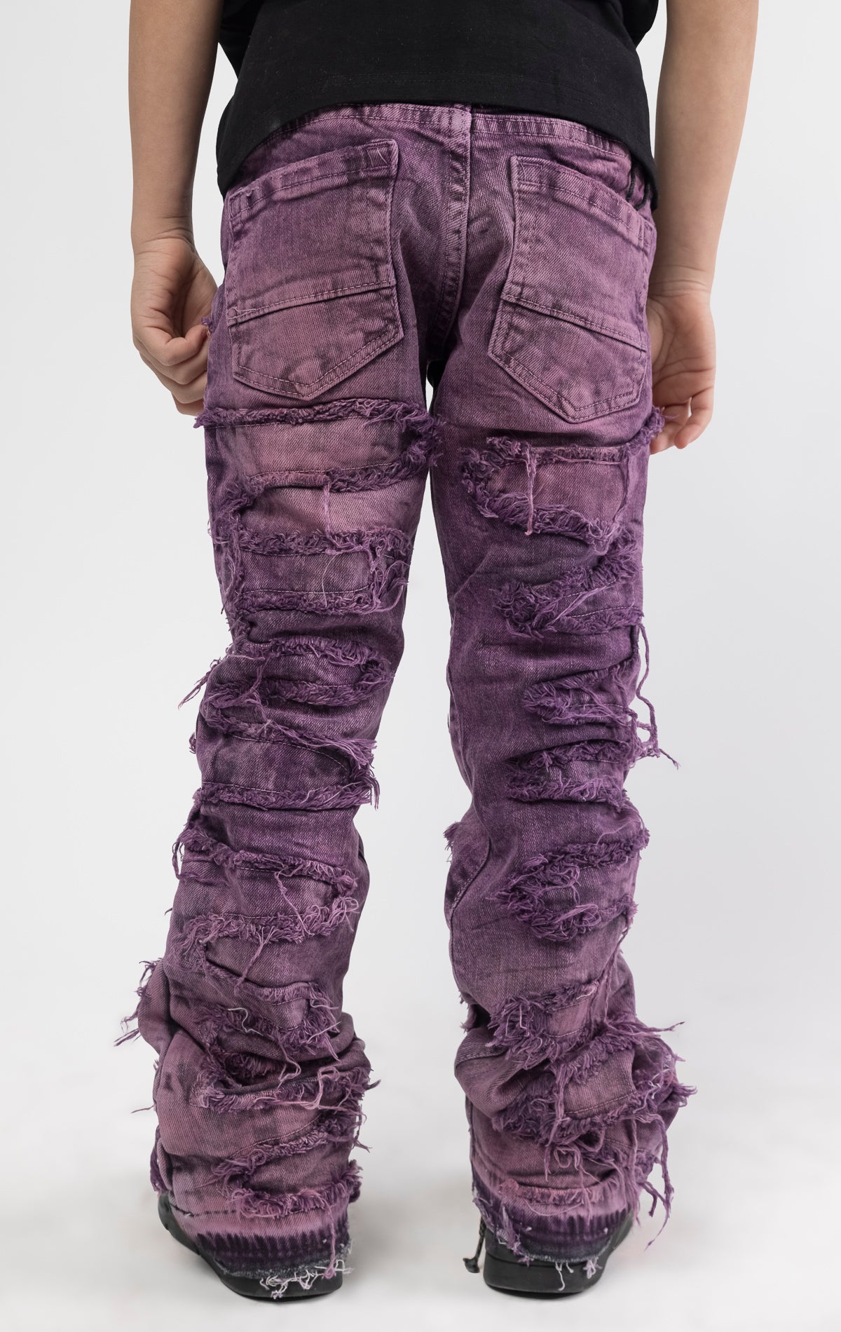 Skinny fit Regular rise denim with extended length for maximum stacks. Blush ombre wash with rip and repair design featuring self fabric backing. Patches and abrasions throughout for a trendy and edgy look.