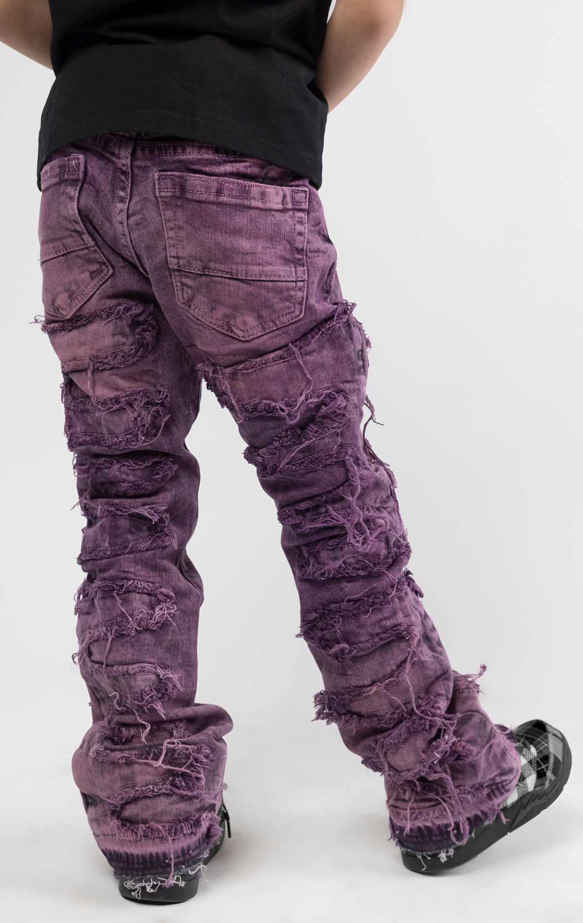 Skinny fit Regular rise denim with extended length for maximum stacks. Blush ombre wash with rip and repair design featuring self fabric backing. Patches and abrasions throughout for a trendy and edgy look.