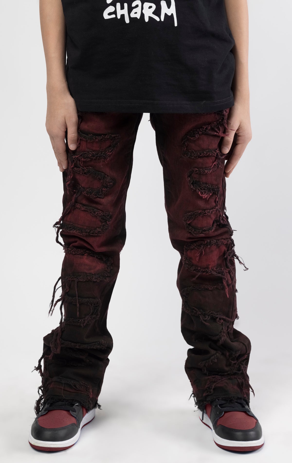 Skinny fit Regular rise denim with extended length for maximum stacks. Magma ombre wash with rip and repair design featuring self fabric backing. Patches and abrasions throughout for a trendy and edgy look.