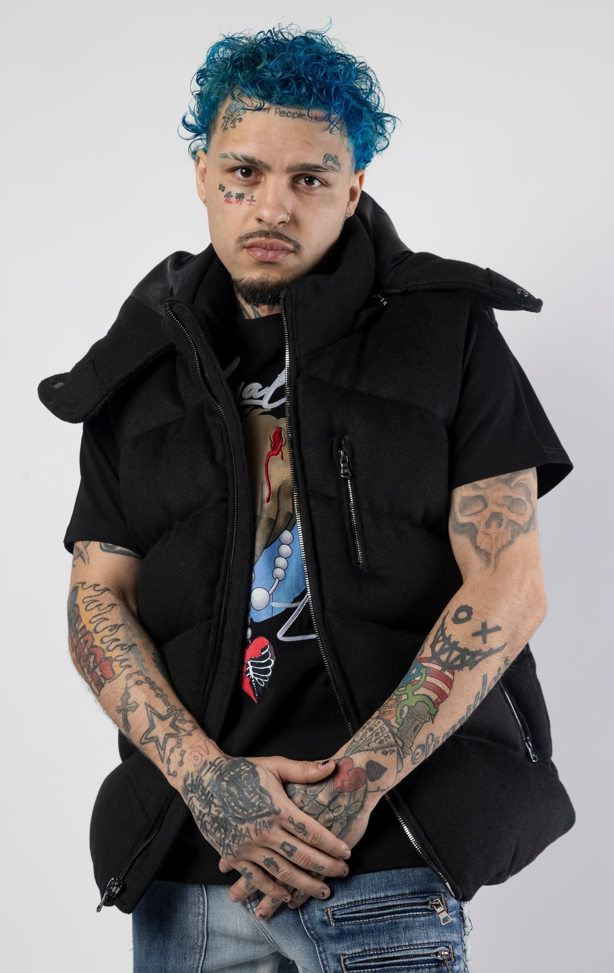 Black sleeveless puffer jacket with zip-up closure.