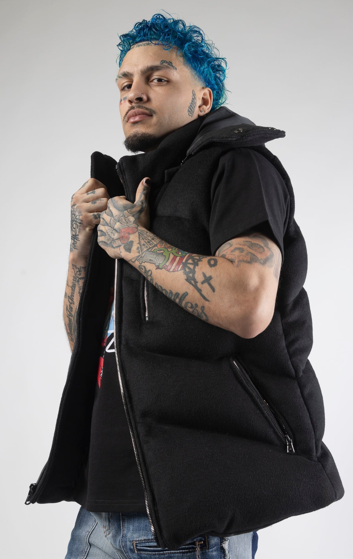 Black sleeveless puffer jacket with zip-up closure.