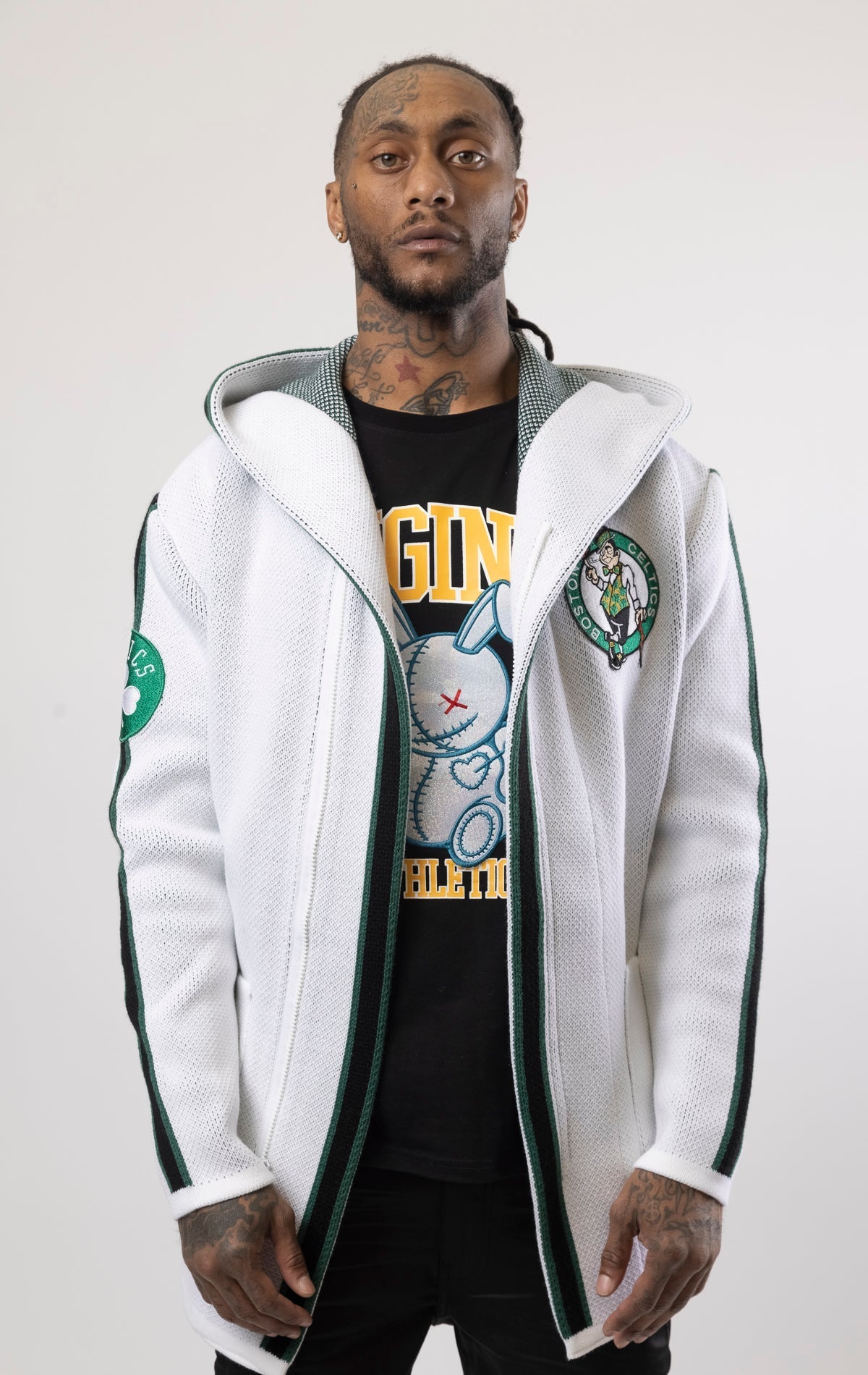 Upgrade your game day look with this Boston Celtics Cardigan Sweater. This cozy jacket is designed with a stylish three-quarter length and boasts bold team branding on the front, back, and sleeve. Complete with a full-zip closure, attached hood, and front