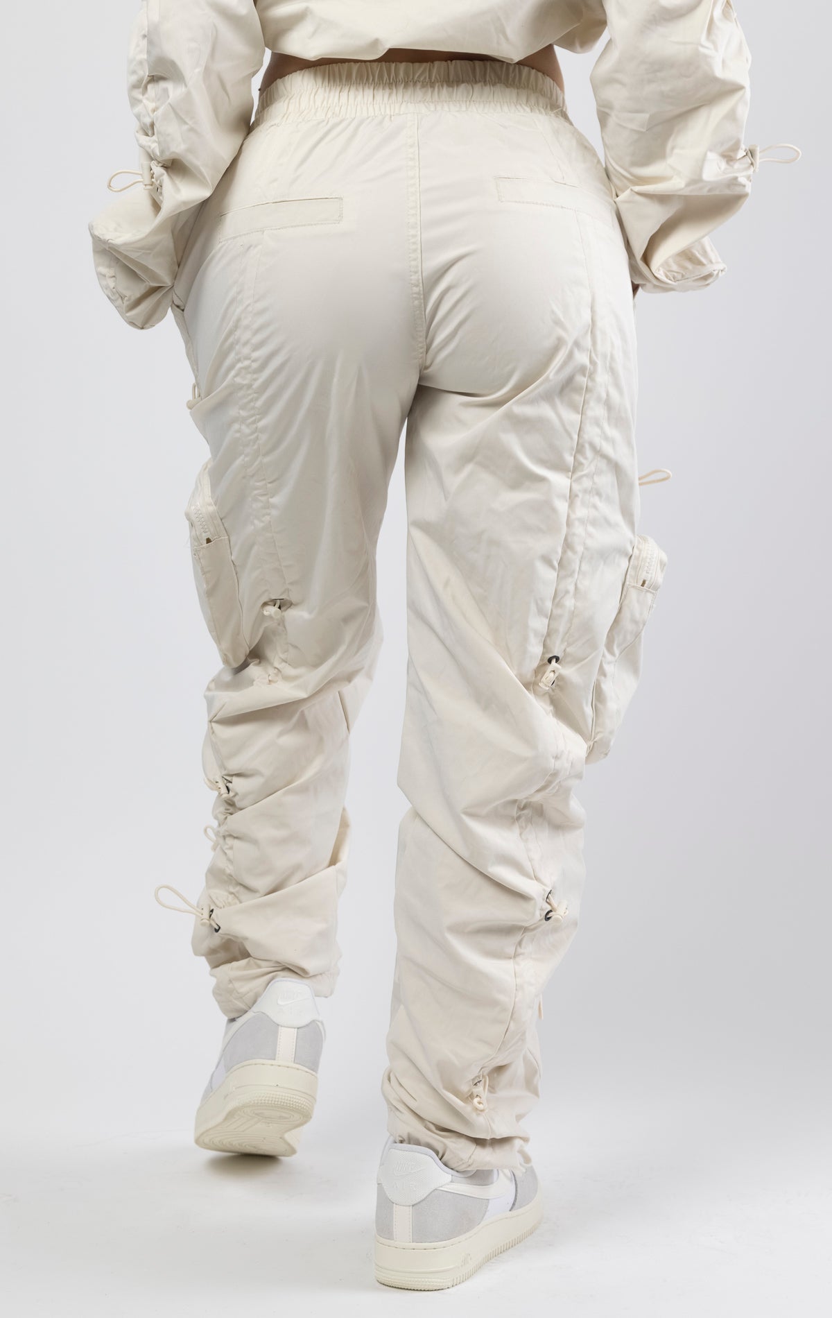 Oatmeal coral multi-bungee jogger featuring a Brook fit, snap buttons, an adjustable waist and wide pockets.