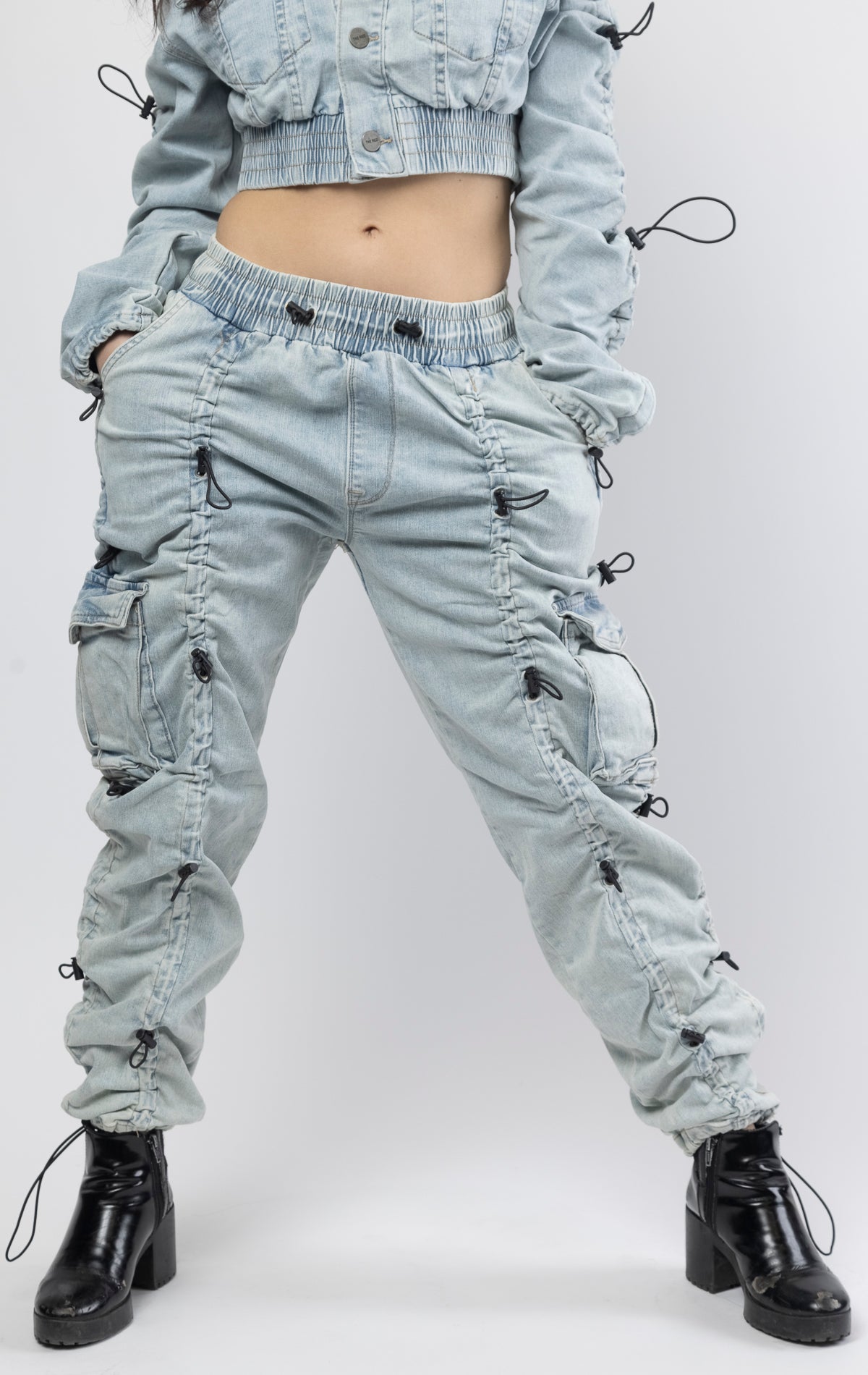 multi-bungee denim jogger features an adjustable waist and wide pockets