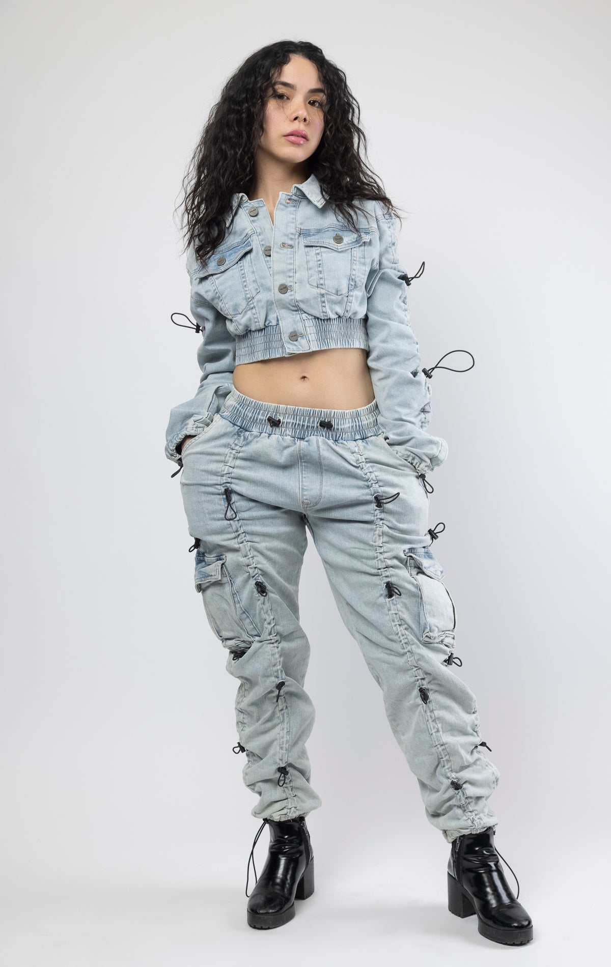 multi-bungee denim jogger features an adjustable waist and wide pockets