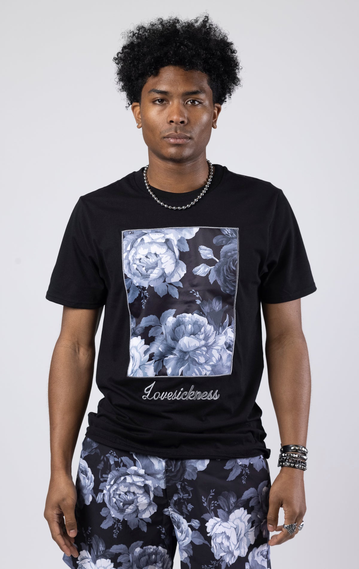 Black A slim-fit vintage rose graphic t-shirt with a crew neck.