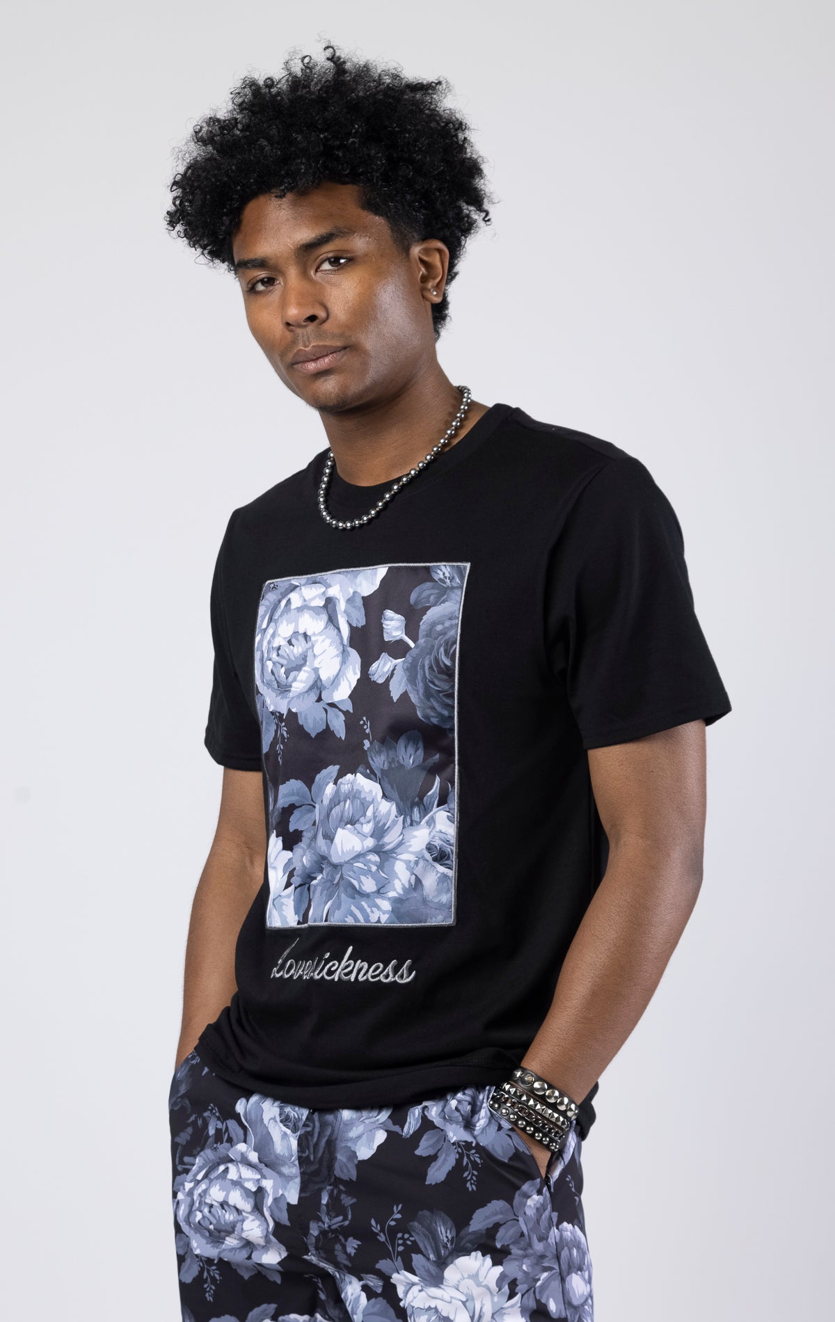 Black A slim-fit vintage rose graphic t-shirt with a crew neck.