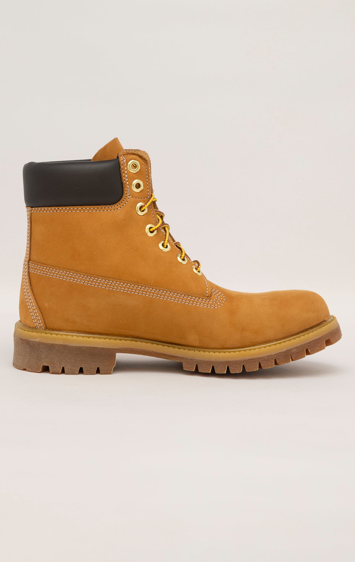Timberland 6-Inch boots in premium wheat nubuck leather with waterproof construction, padded collar, and lug outsole