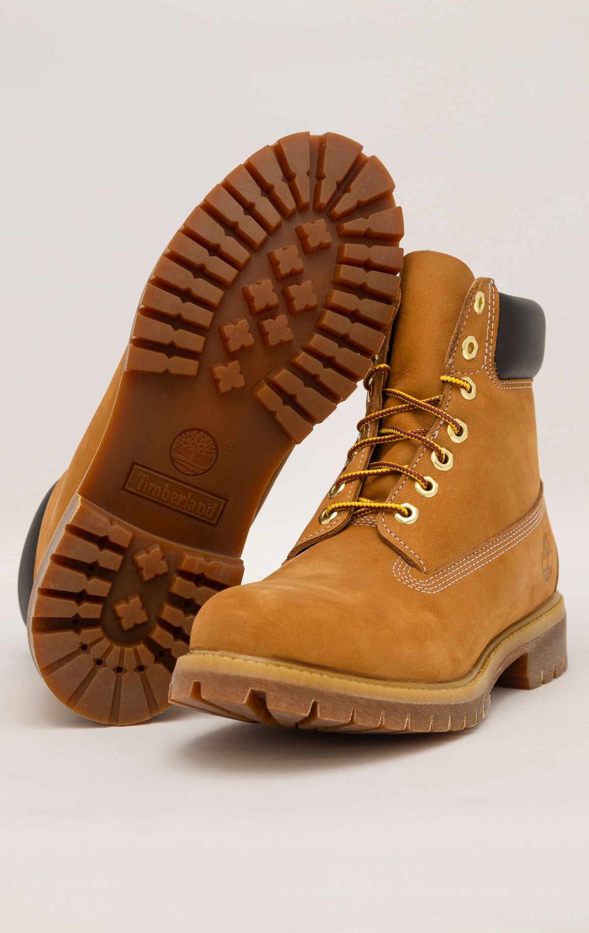Timberland 6-Inch boots in premium wheat nubuck leather with waterproof construction, padded collar, and lug outsole
