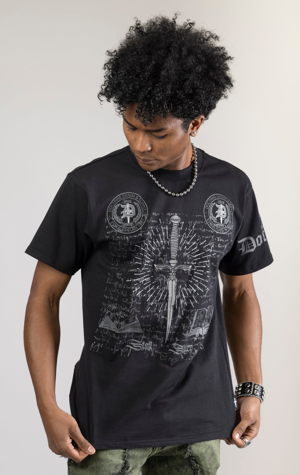 black CORE DAGGER vintage graphic t-shirt. The shirt is made from 100% cotton with a vintage wash and features a high-definition digital graphic on the front.