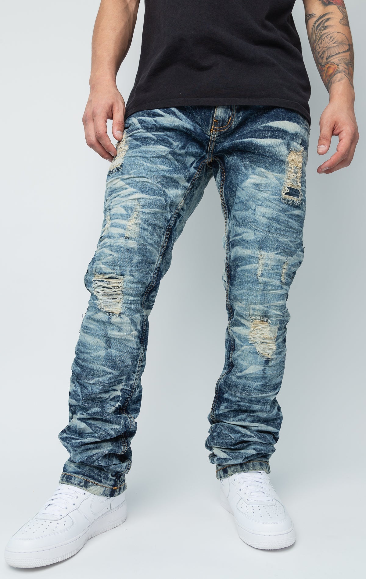 Blue ripped low-waisted slim jeans.