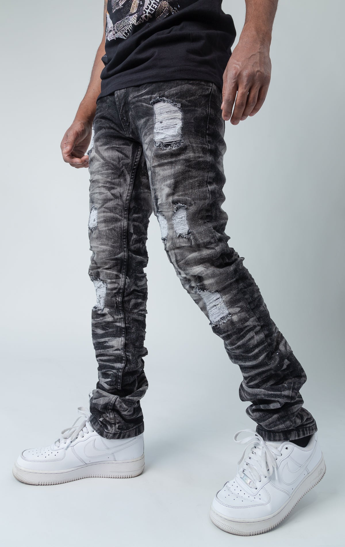 Black ripped low-waisted and slim jeans.