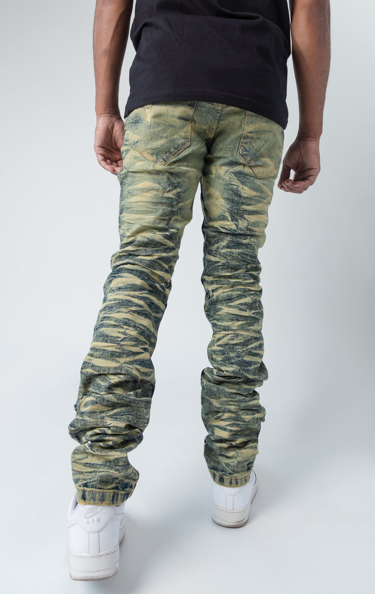 Tinted ripped low-waisted slim jeans.