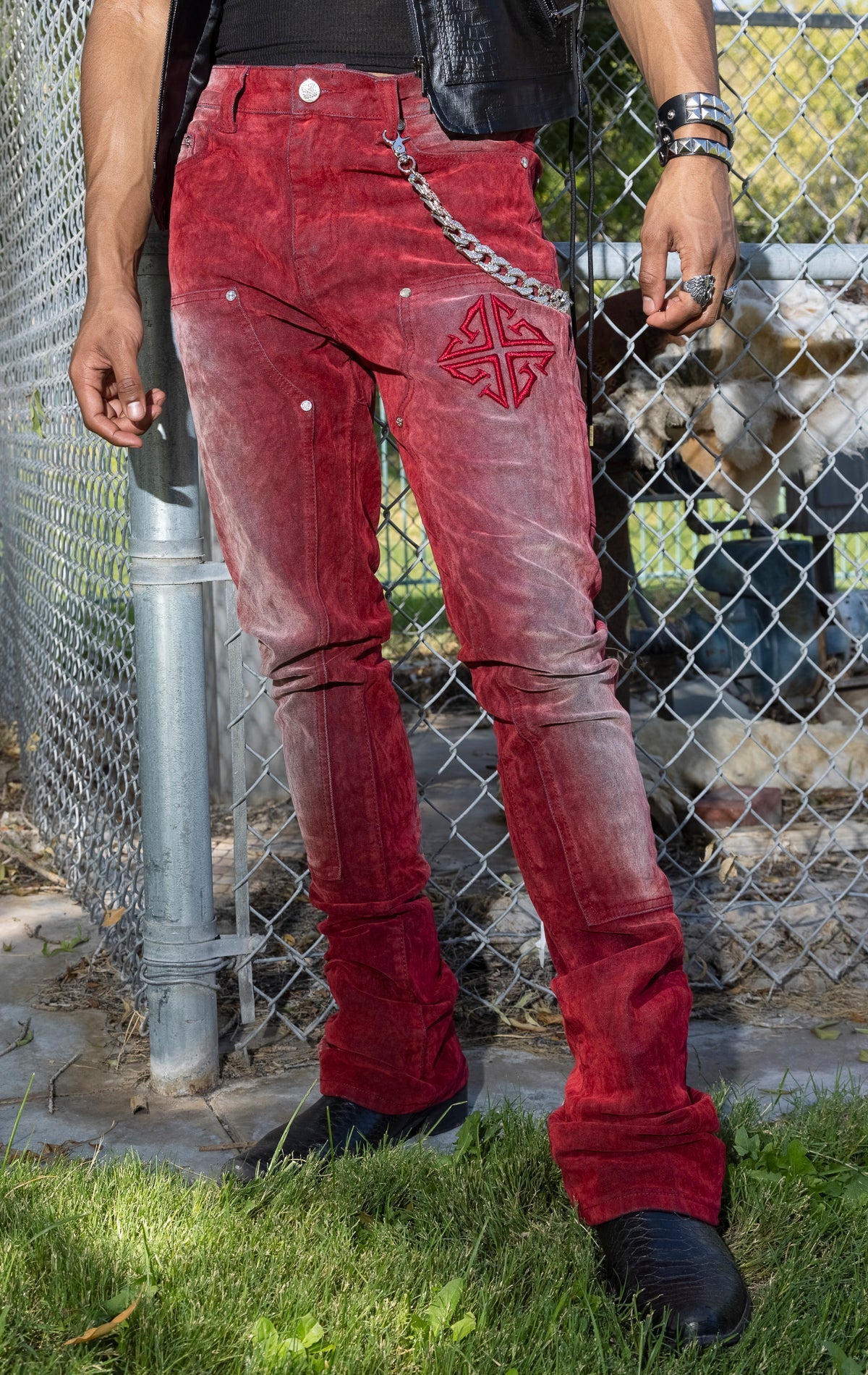Red Skinny Jeans. Made from a stretchy denim blend. Features a tapered fit, side pockets, back pockets, and subtle embroidery.