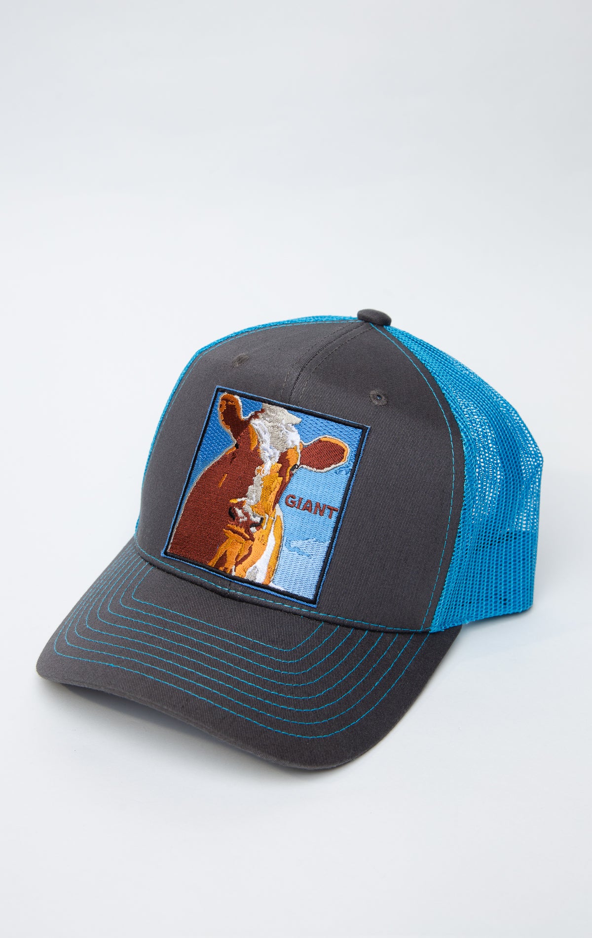 Black and blue trucker hat with cow giant graphic