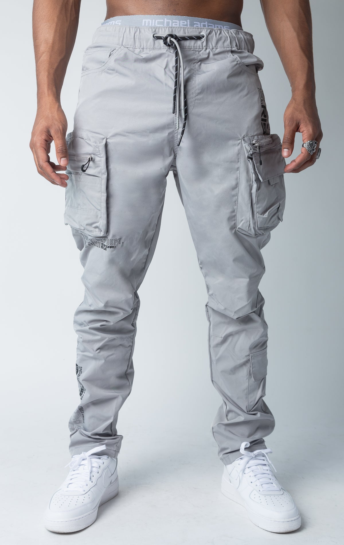 Grey windbreaker utility pants, sleek fit with an open bottom jogger style