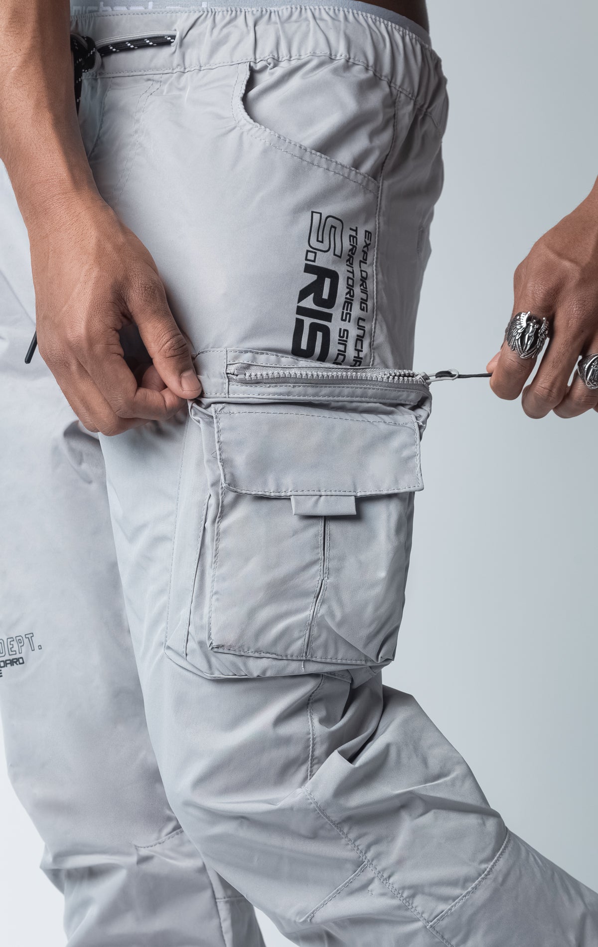 Grey windbreaker utility pants, sleek fit with an open bottom jogger style