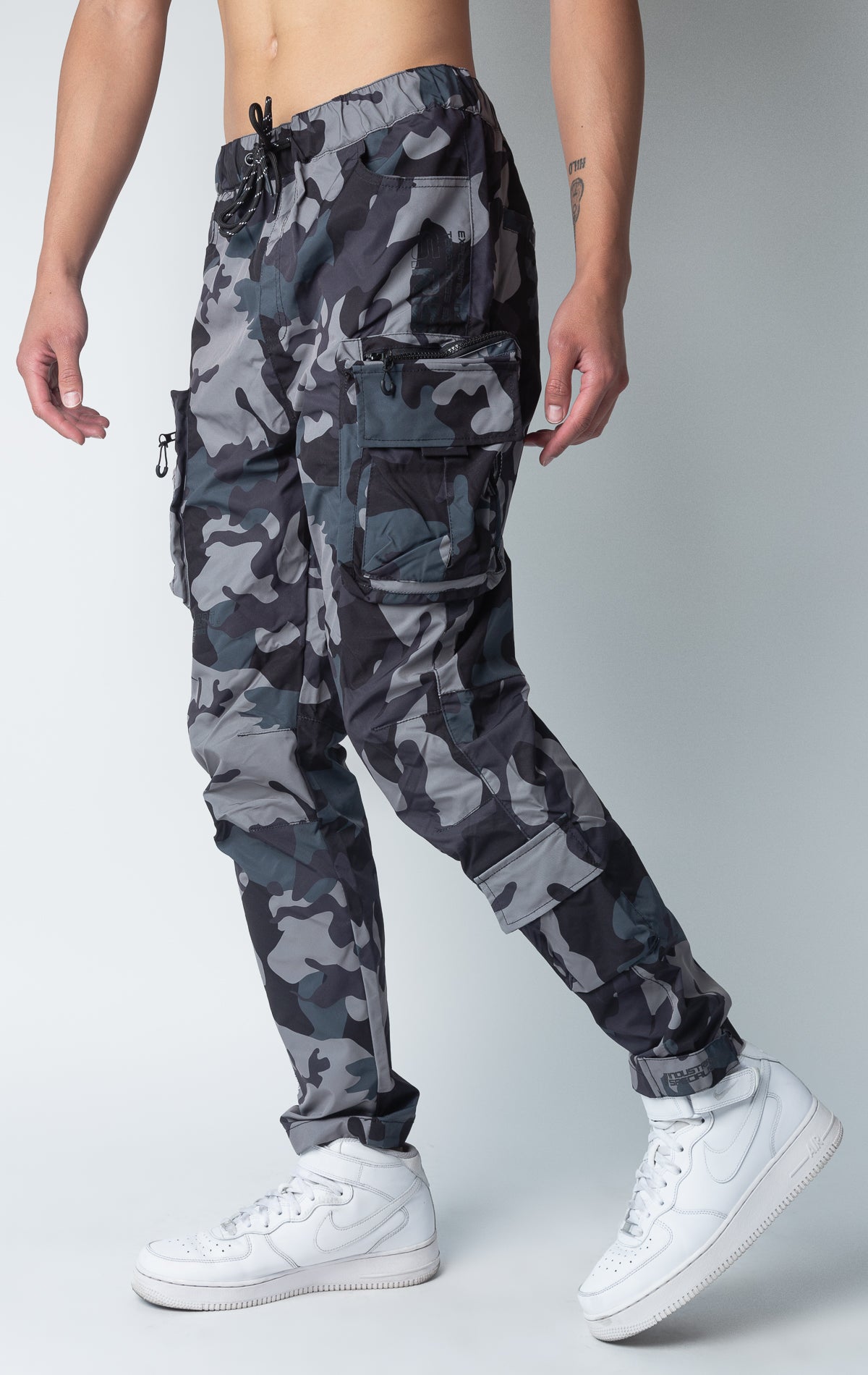 Camo windbreaker utility pants, sleek fit with an open bottom jogger style