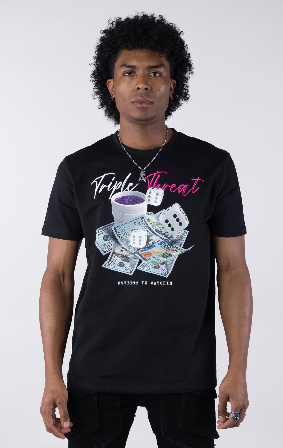 Black t-shirt with a detailed graphic featuring a pile of $100 bills, two dice, and a white cup with purple liquid. The text "Triple Threat" is printed above the image in white and pink script.