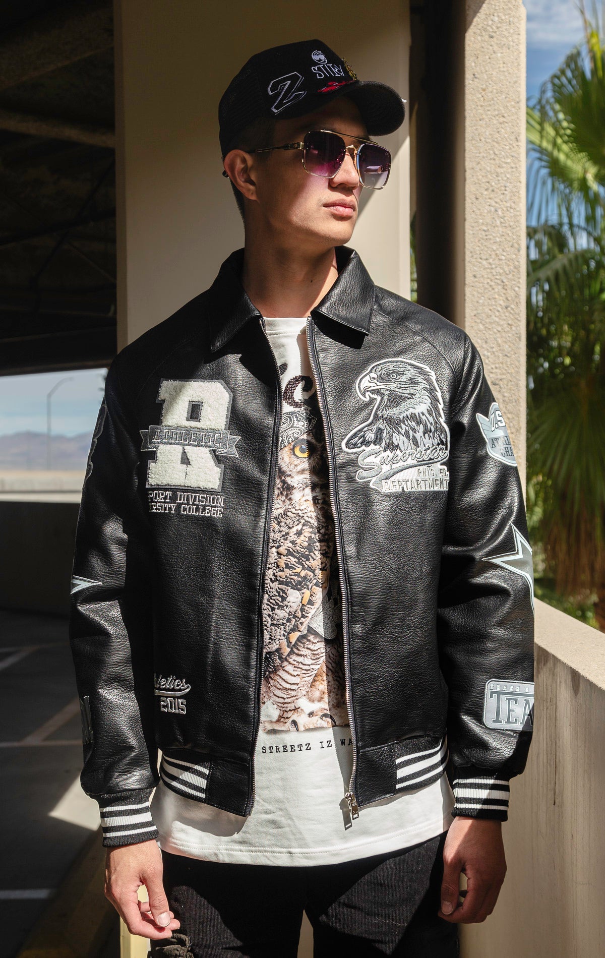 Black U.S.A. Varsity Jacket with patches, zip-up front, and quilted lining