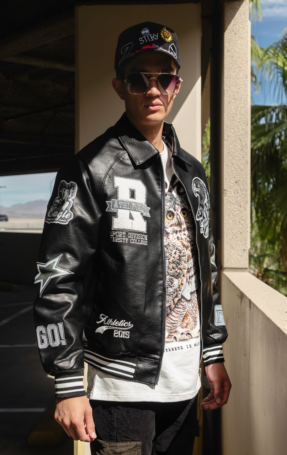 Black U.S.A. Varsity Jacket with patches, zip-up front, and quilted lining