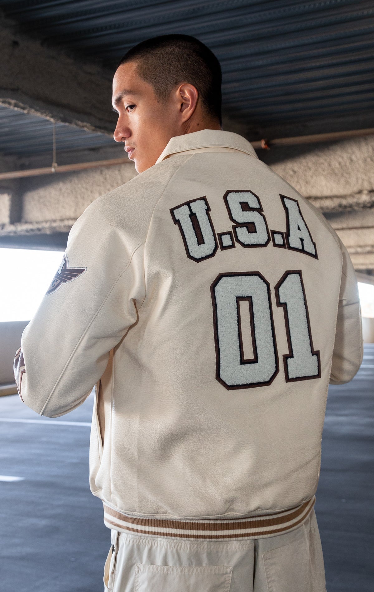 Cream U.S.A. Varsity Jacket with patches, zip-up front, and quilted lining