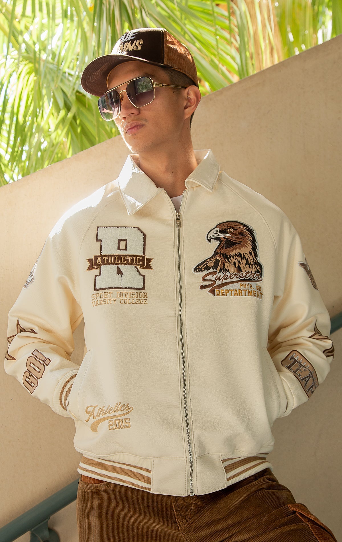 Cream U.S.A. Varsity Jacket with patches, zip-up front, and quilted lining