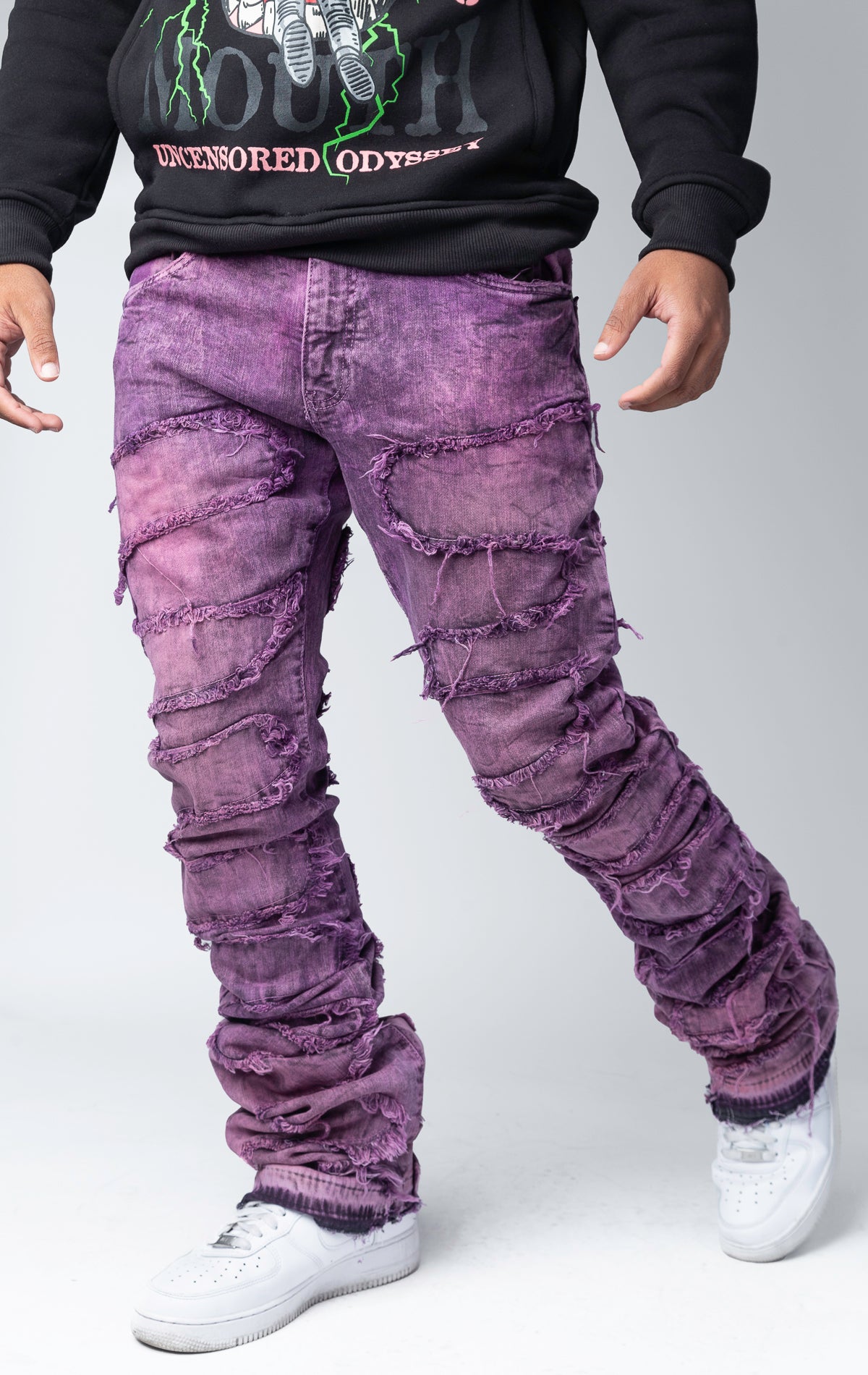 Blush distressed and stacked flare jeans featuring an ombre wash and ripped details