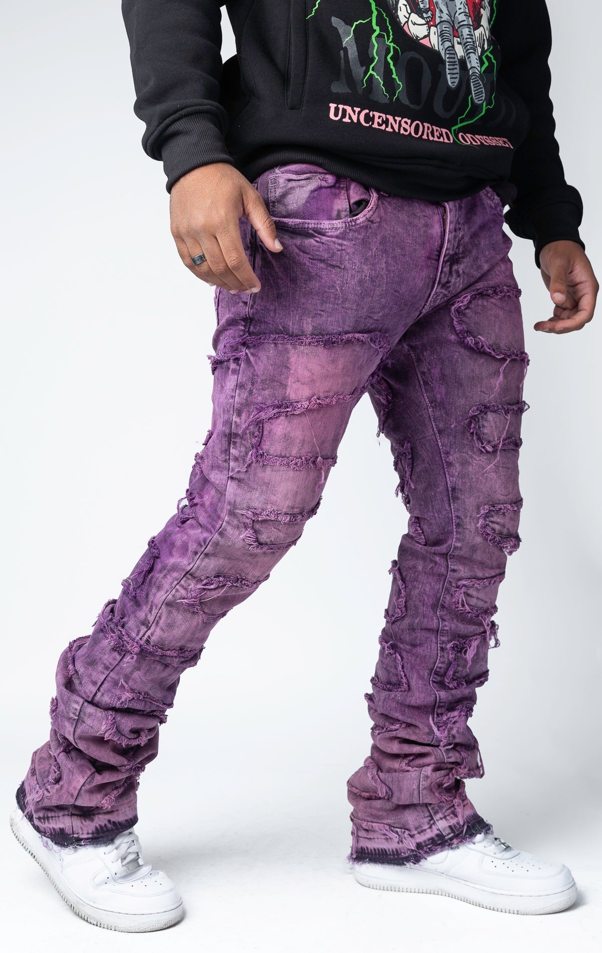 Blush distressed and stacked flare jeans featuring an ombre wash and ripped details