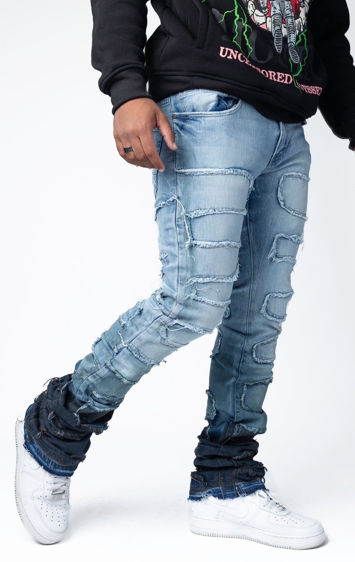 Blue distressed and stacked flare jeans featuring an ombre wash and ripped details