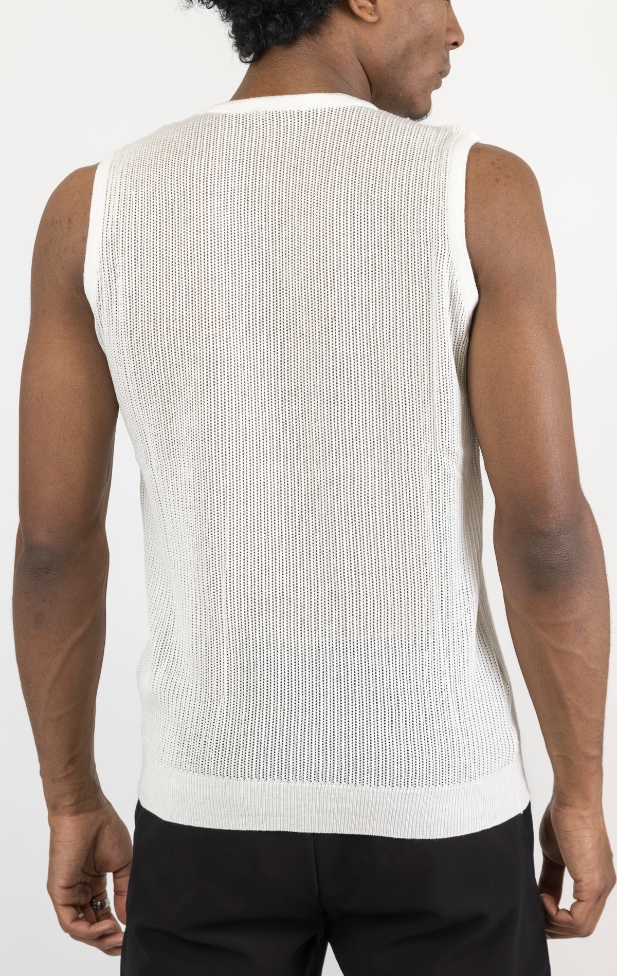 Men's crew neck mesh tank top in white. The tank top is made from a lightweight and breathable mesh fabric (50% cotton, 50% acrylic) and features a sleeveless construction and a tailored fit.