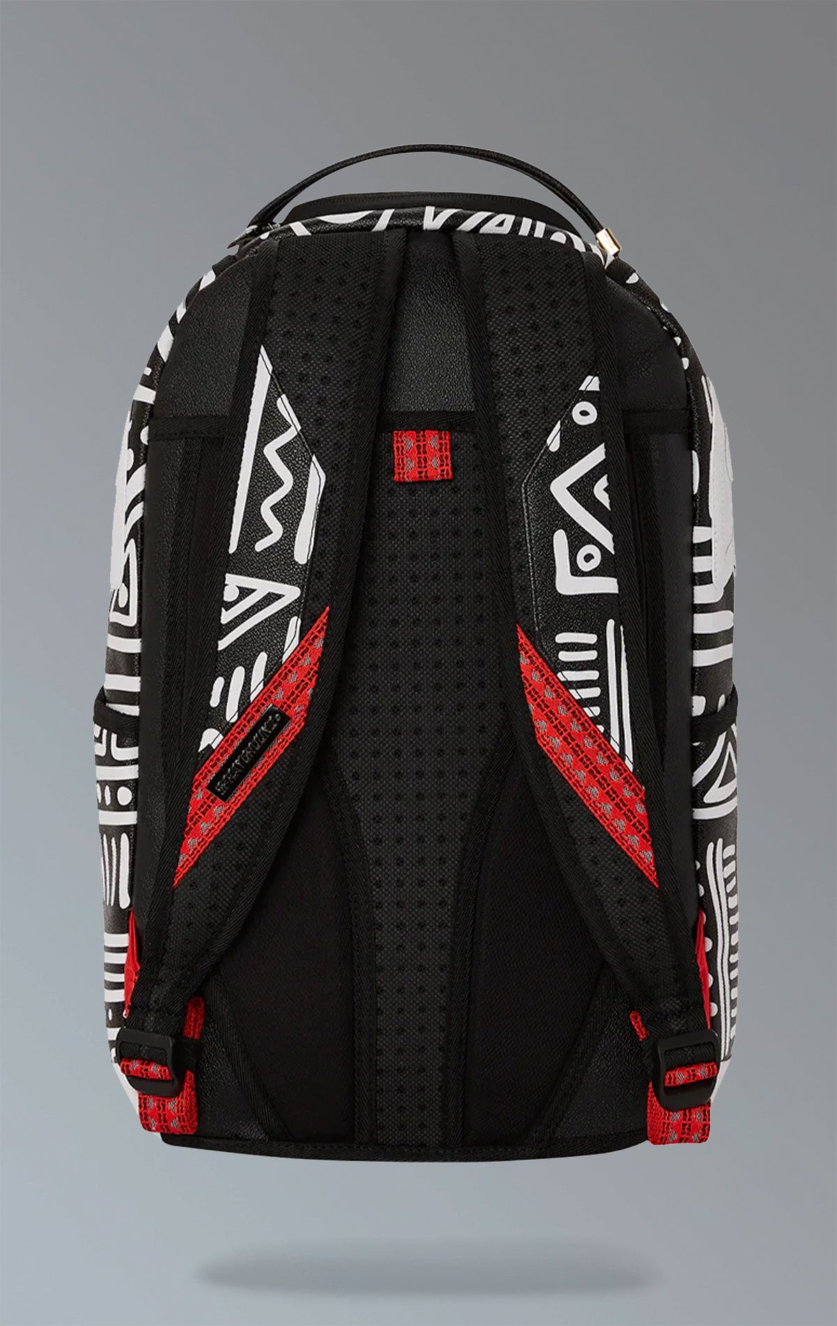 White Sprayground backpack with a captivating AI tribal design. Features multiple compartments including a separate velour laptop compartment, side pockets, and a hidden zippered pocket. Equipped with ergonomic mesh back padding, adjustable straps, and a slide-through back sleeve for attaching to carry-on luggage. Made from durable water-resistant faux leather.