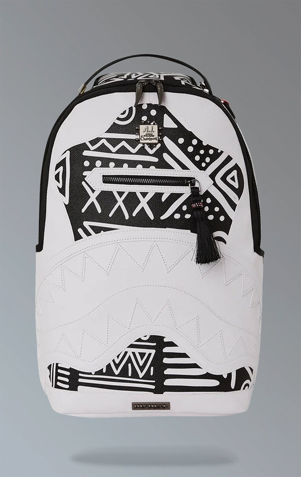 White Sprayground backpack with a captivating AI tribal design. Features multiple compartments including a separate velour laptop compartment, side pockets, and a hidden zippered pocket. Equipped with ergonomic mesh back padding, adjustable straps, and a slide-through back sleeve for attaching to carry-on luggage. Made from durable water-resistant faux leather.