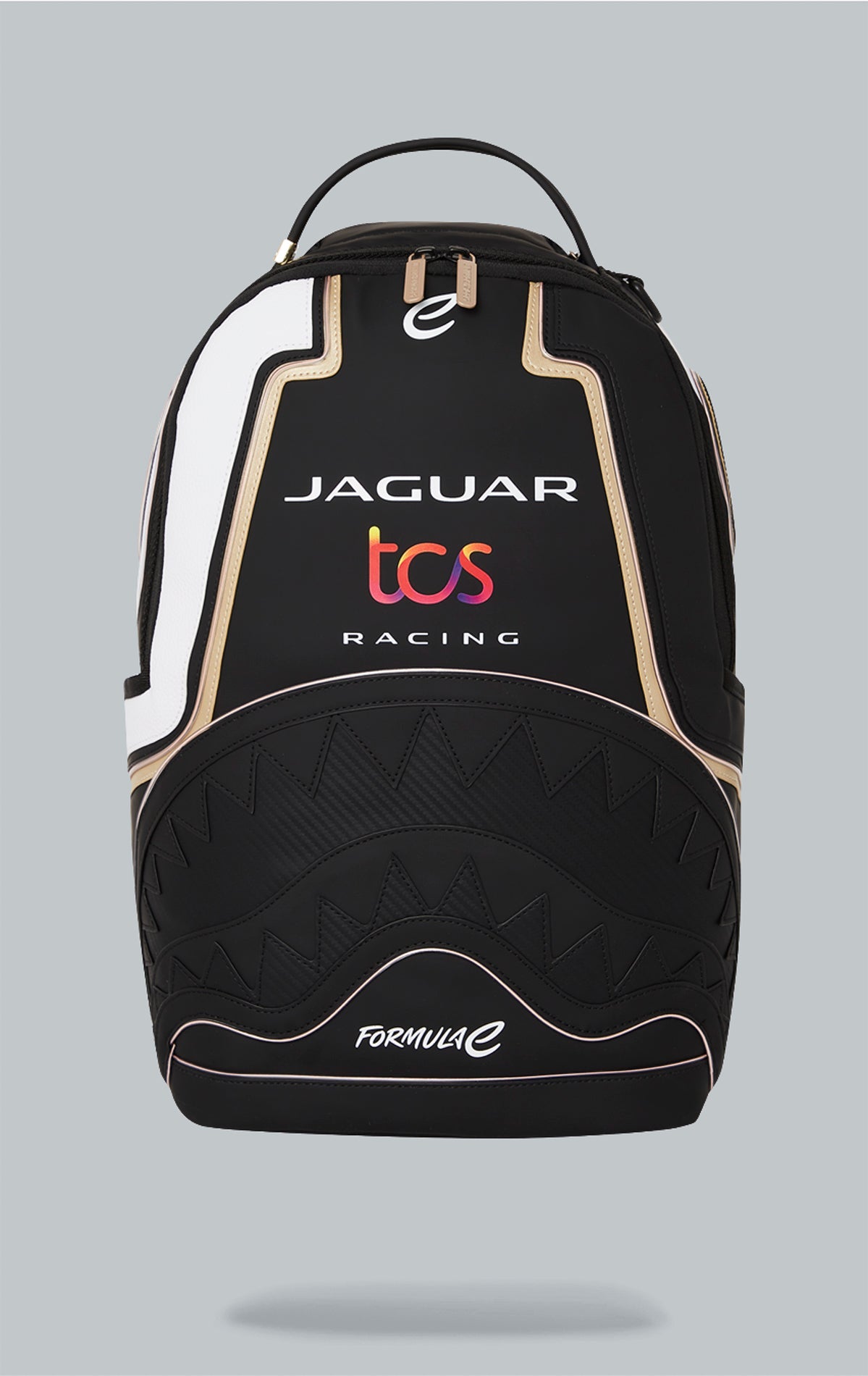 Sprayground x Formula E Jaguar backpack with built-in LED lights. Black water-resistant PVC backpack with Formula E Jaguar design. Includes laptop compartment, organizer pocket, and USB cable for charging. Note: Lithium battery inside, check with airline