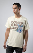 Stylish off white T-shirt featuring a motivational 'Young, Rich, and Lucky' slogan