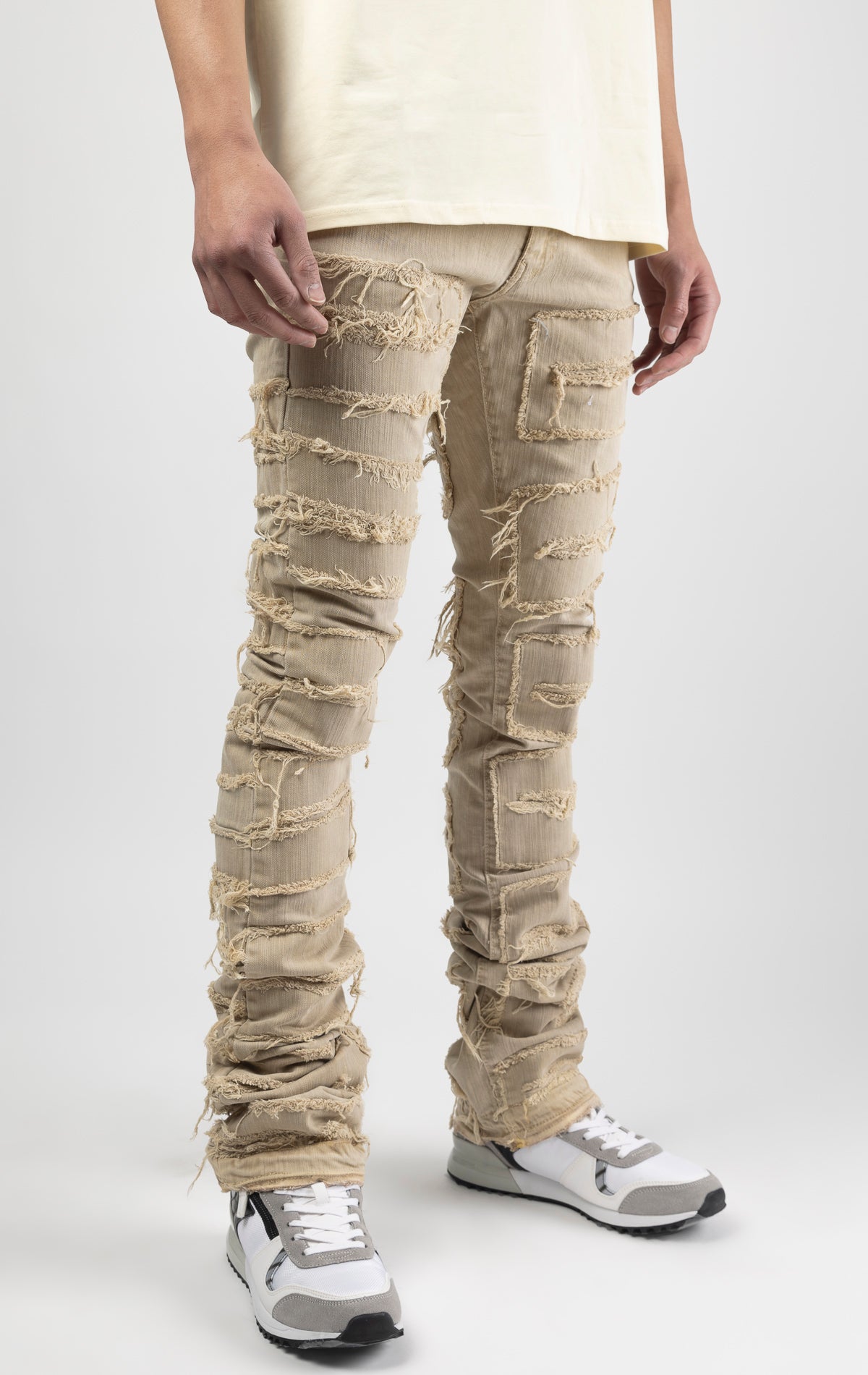 Cream bold, risk-taking flare pants feature a regular rise and extended length for maximum stacks. With a unique heavy wash and rip and repair design, complete with patches and abrasions, these skinny fit jeans are ready for adventure. Made from 98% cotton and 2% Lycra