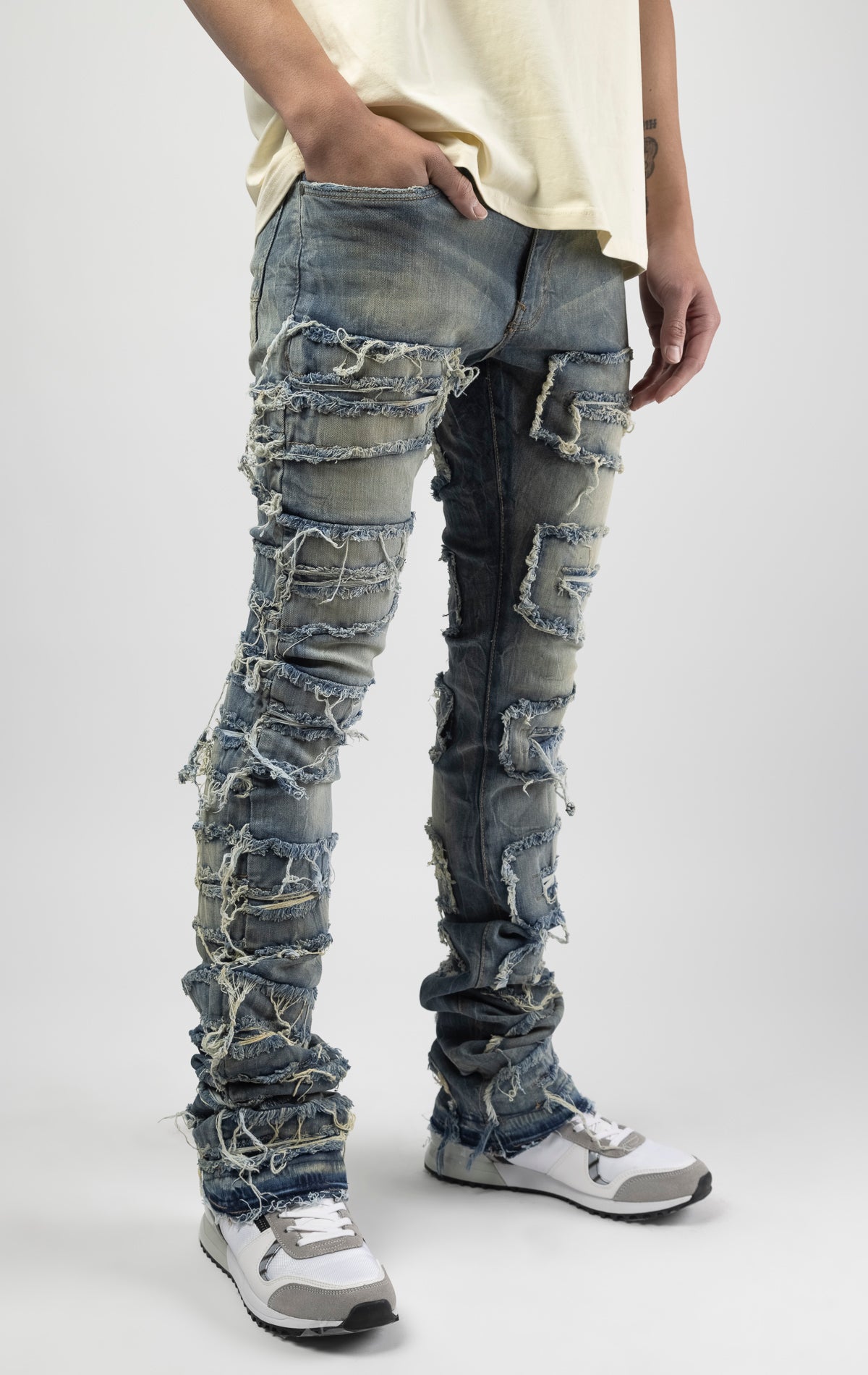 Lager bold, risk-taking flare pants feature a regular rise and extended length for maximum stacks. With a unique heavy wash and rip and repair design, complete with patches and abrasions, these skinny fit jeans are ready for adventure. Made from 98% cotton and 2% Lycra