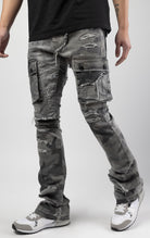 Overcast camo extended length flare pant with a regular rise for maximum stacks. Skinny fit with hand-smearing and speckled paint splatter throughout. Rip and repair detailing, accompanied by cut & sewn woodland camouflage twill patches. Stitching repairs and deep front pocket bags, perfect for large smart phones.