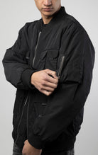 Men's utility bomber jacket with 5 pockets on the front (Velcro, zip, and snap closure), ribbed collar and cuffs, as well as a sleeve pocket 