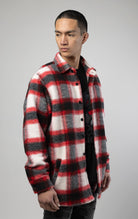 Model wearing Red, white and black oversized button up shirt made from soft, felted fabric